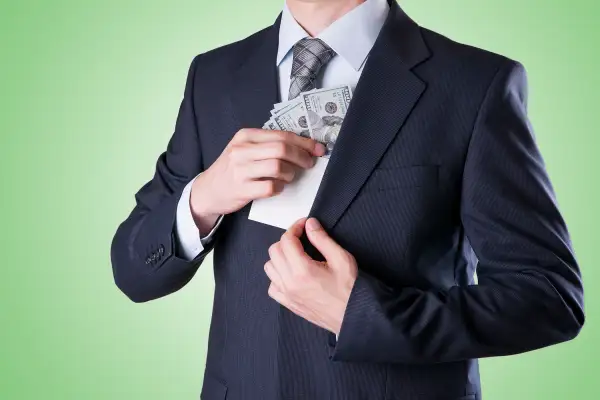 pulling money out of suit pocket
