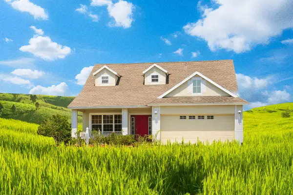 Photo collage of a suburban house on an open green field
