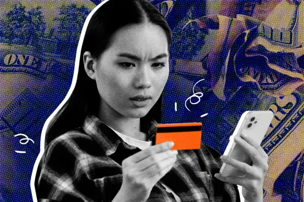 Woman with worried expression, holding a smartphone and a credit card