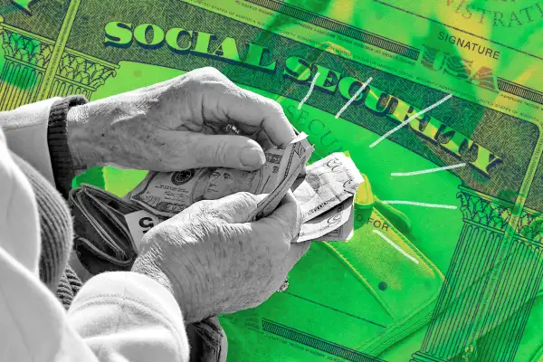 hands counting dollar bills in front of Social Security card